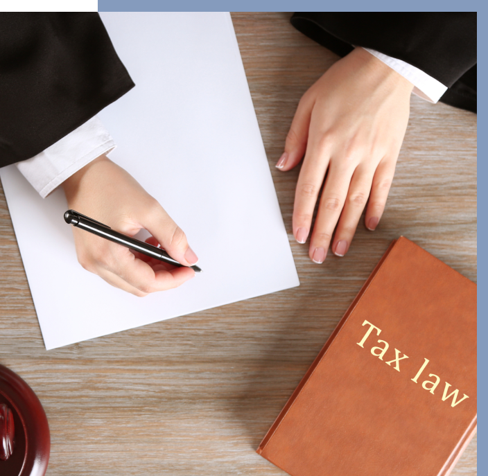 Tax law book and lawyer photo Tax law book and lawyer