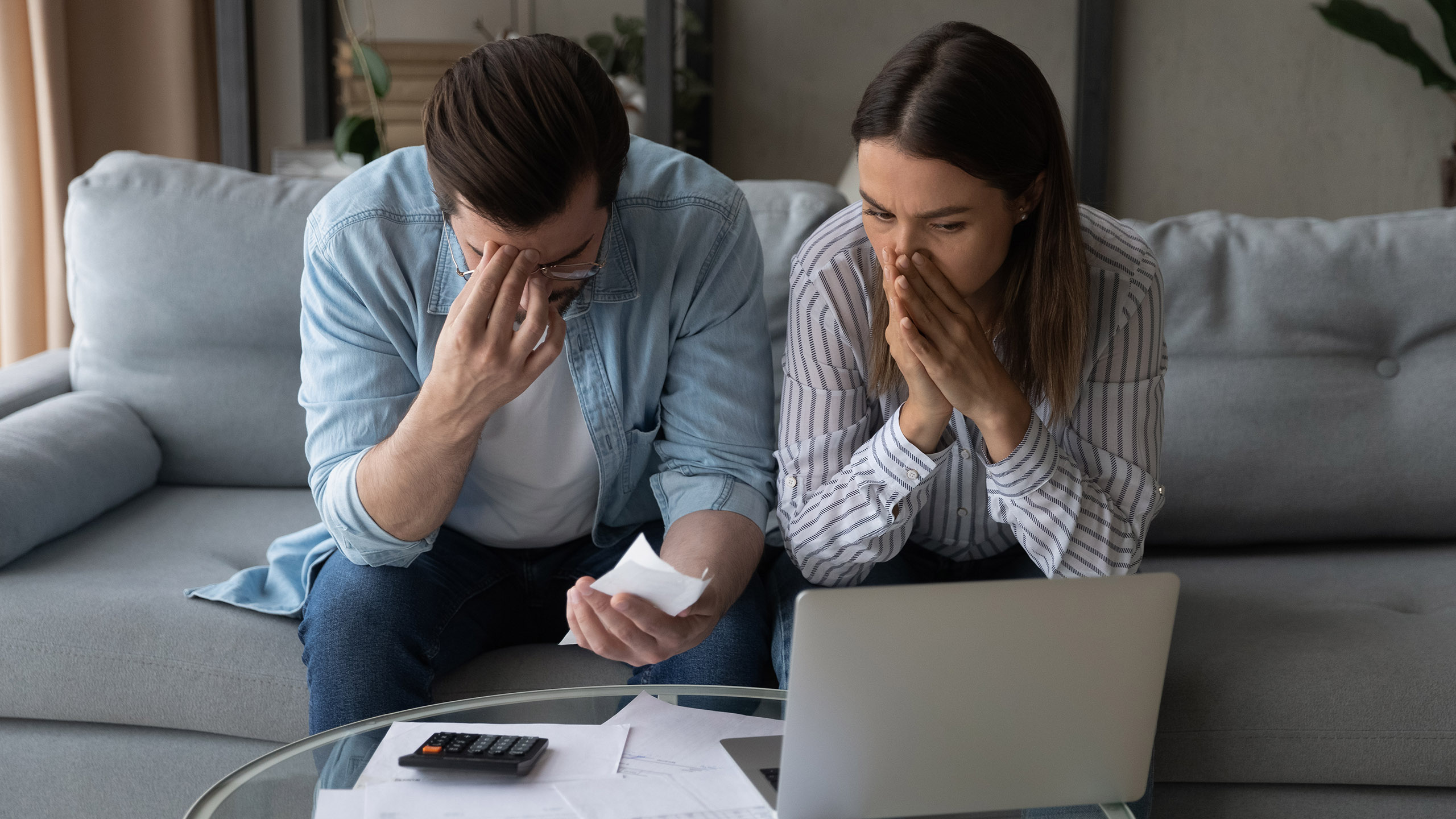 Stressed Missouri business owners review financial documents